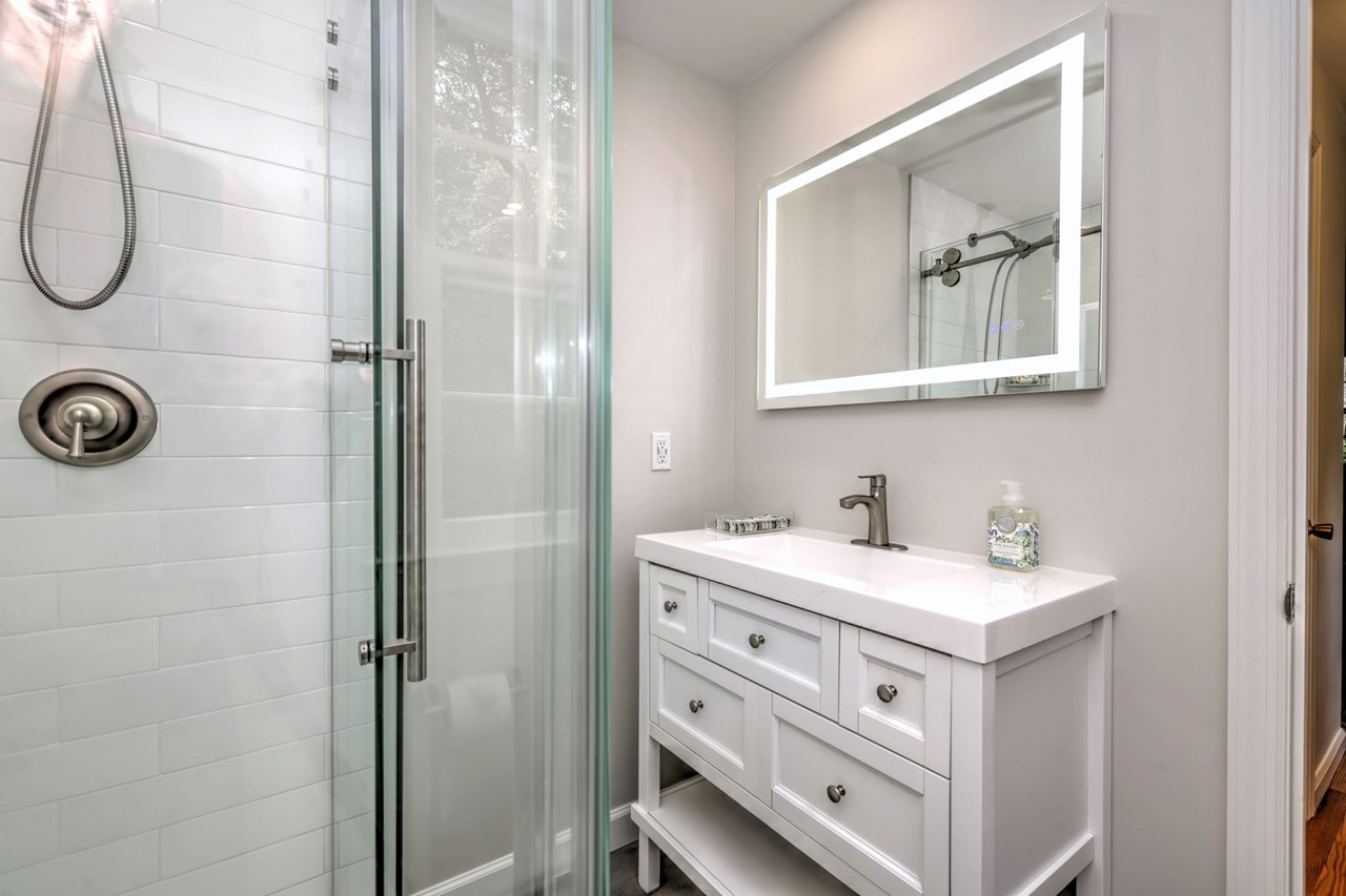 totally renovated primary bathroom with stylish updates and a fresh, modern feel.