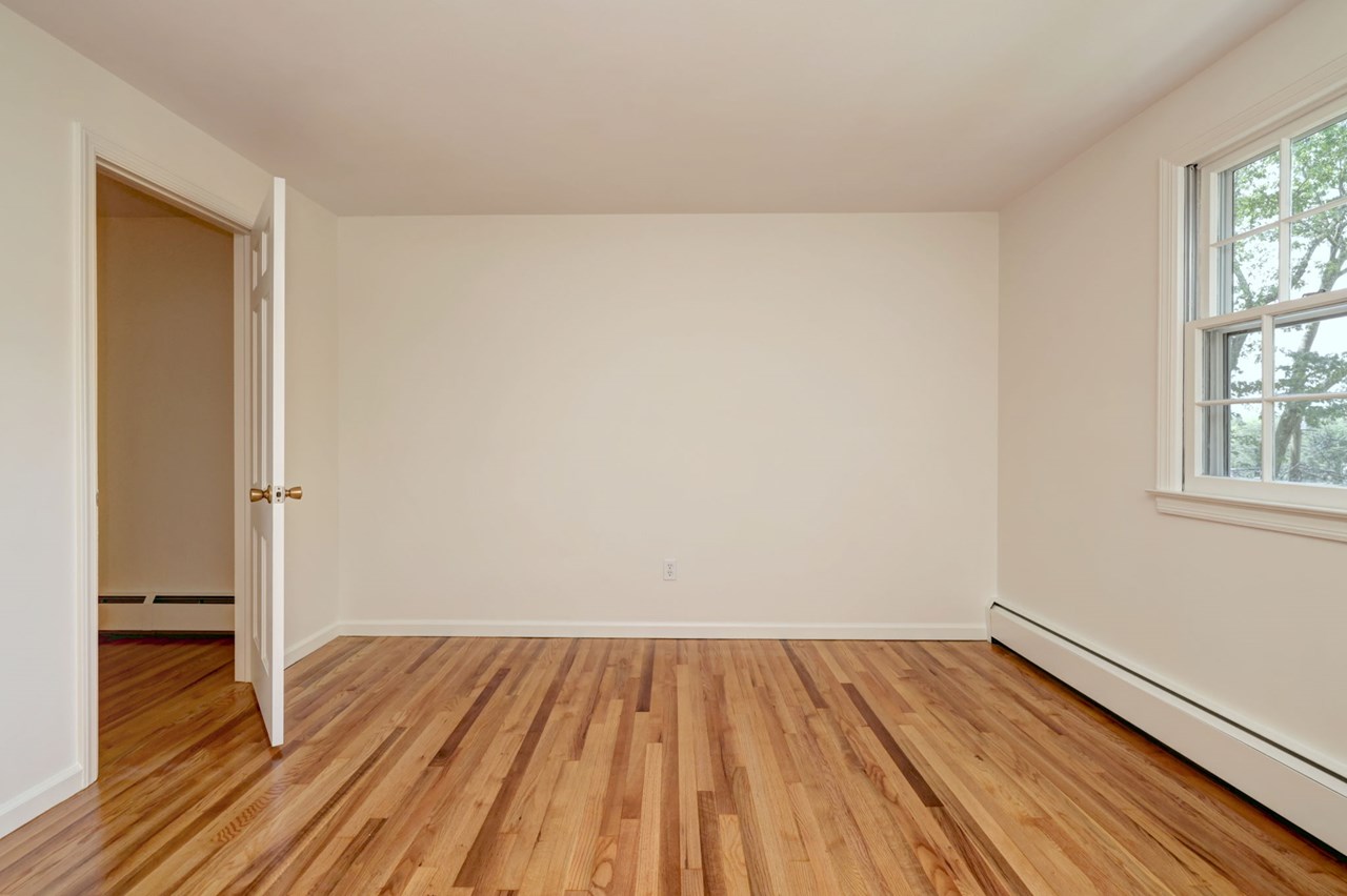 bedroom 4 serene bedroom with hardwood floors and generous closet space - perfect for restful nights.