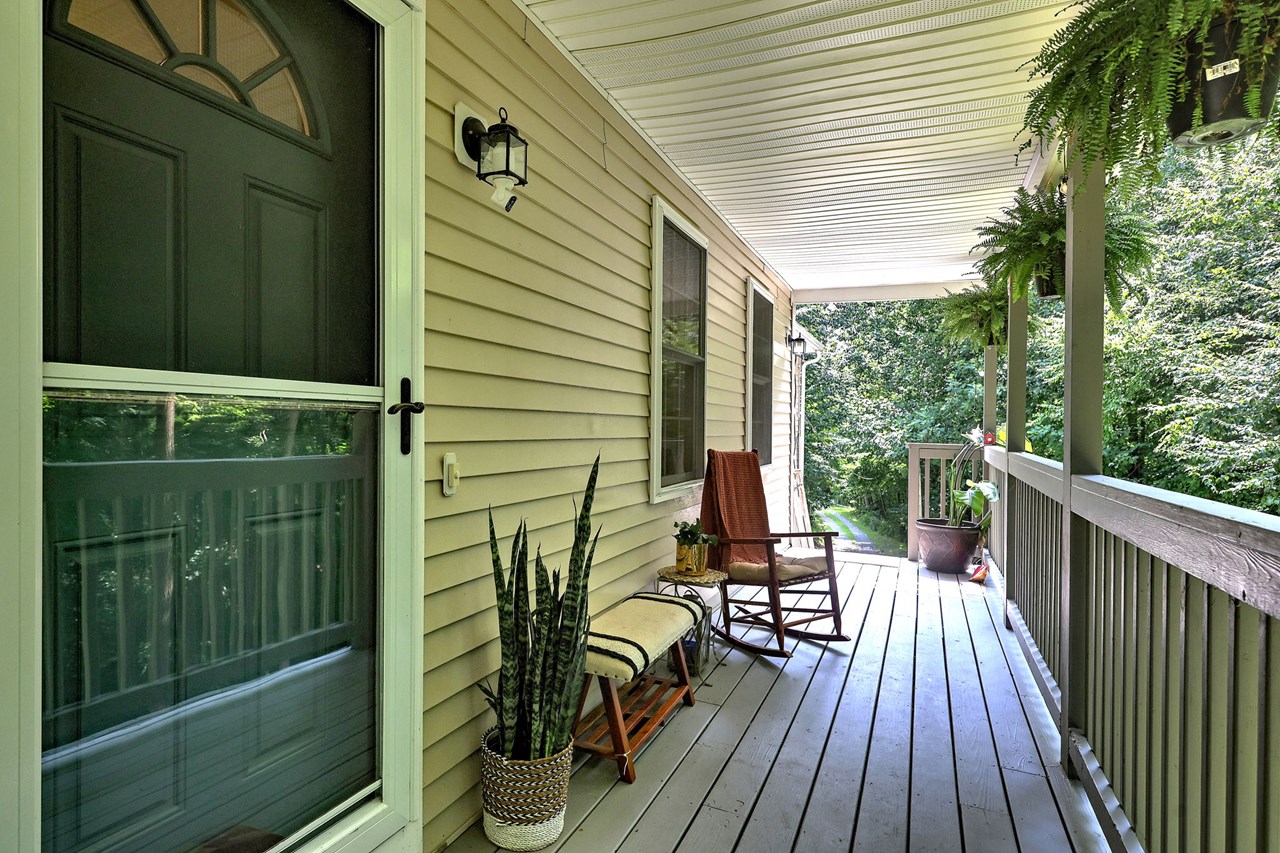 start your day with a cup of coffee or unwind in the evening on the welcoming covered front porch.