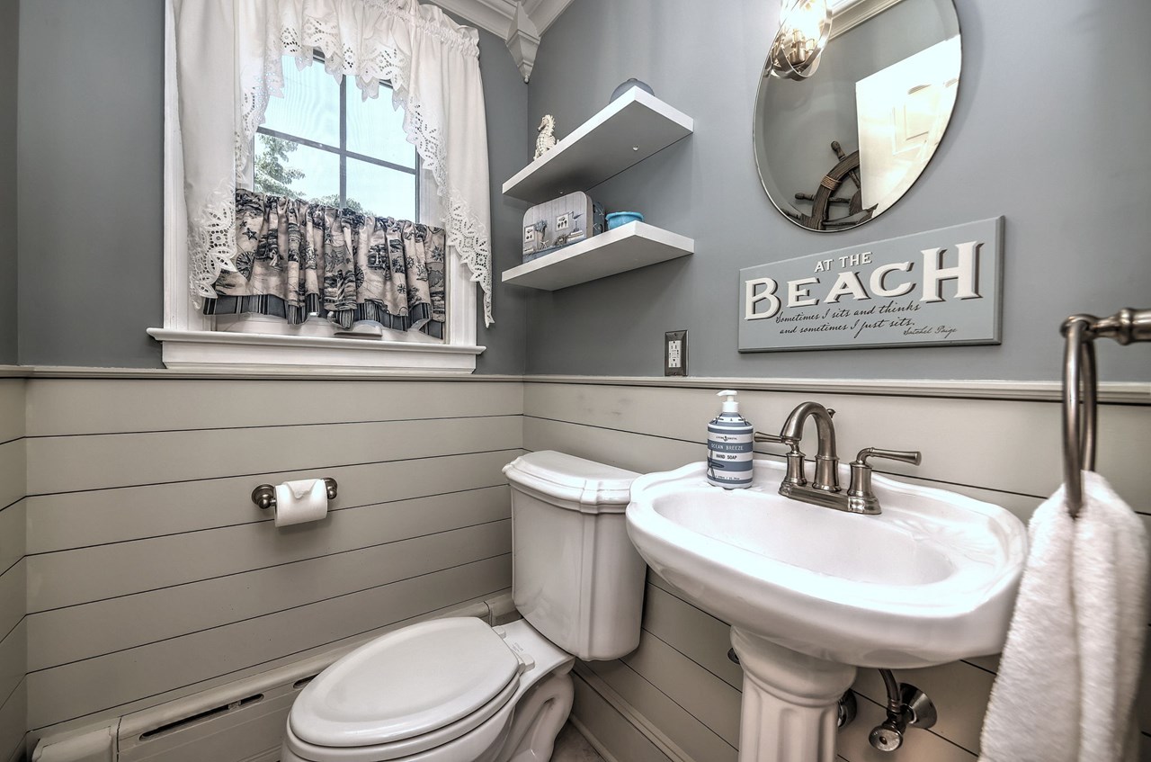 beautifully renovated half bath with modern finishes and timeless style.