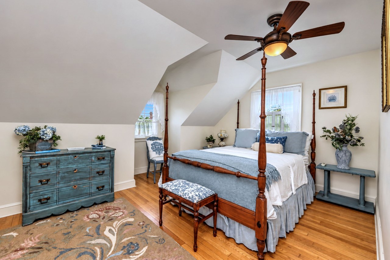 comfortable and well-sized bedroom with natural light.