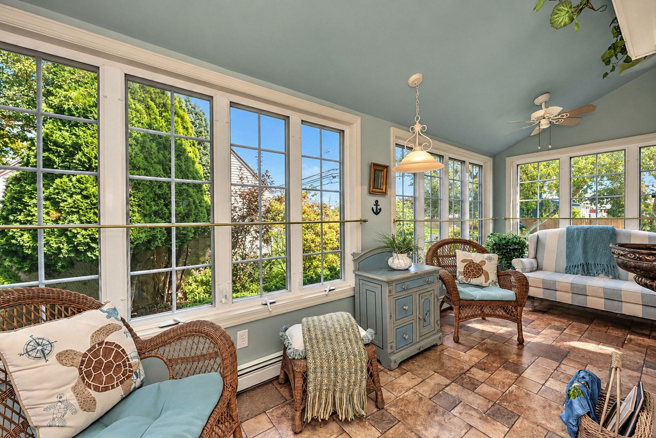 wrapped in windows and overlooking the gardens, the sun room creates a bright, inviting space for relaxing and enjoying the changing seasons.